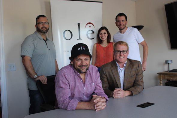 Pictured (L-R:) Randall Foster (ole, Sr. Director, Creative Licensing), Emily Mueller (ole, Creative Manager), and Ben Strain (ole, Creative Director). Front, from left: ole songwriter Marty Dodson and John Ozier (ole, GM Creative)