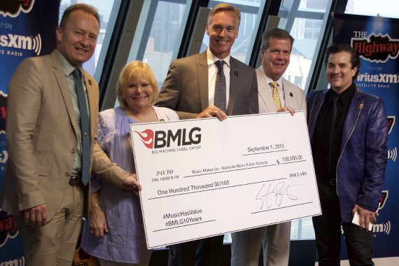 Pictured (L-R): Dr. Jay Steele (Chief Academic Officer), Dr. Nola Jones (Coordinator of Visual and Performing Arts), Chris Henson (Interim Director of Schools), Mayor Karl Dean and BMLG’s Scott Borchetta with $100,000 donation to Music Makes Us. Photo: Lance Goodman