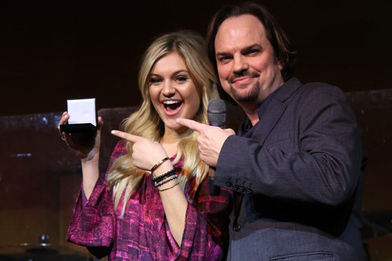 CountryBreakout Breakout Artist and Female Artist of the Year also accepts a Challenge Coin for writing and performing her latest chart-topping hit, "Dibs." Pictured (L-R): Kelsea Ballerini, MusicRow's Owner/Publisher Sherod Robertson.