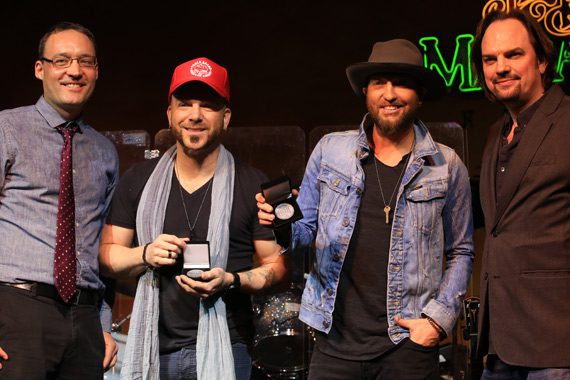 LOCASH accepts No. 1 Challenge Coins for writing and performing the final No. 1 on the MusicRow CountryBreakout Chart of 2015, “I Love This Life” (Dec. 17, 2015)