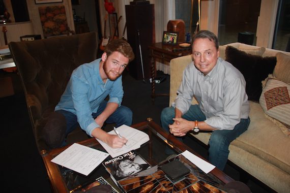Pictured: Newly signed BMI songwriter Ben Haggard and BMI’s Jody Williams pose for a photo in Jody’s office. 